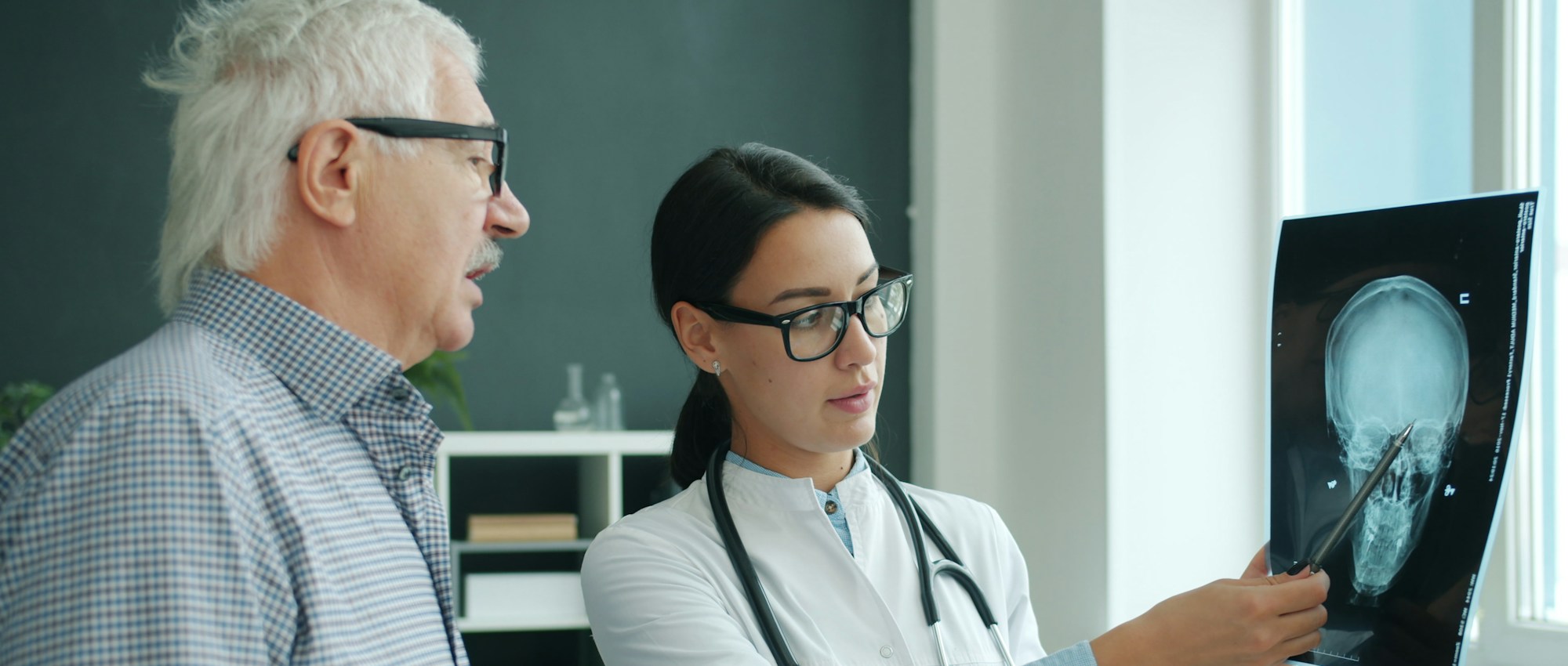 Doctor reviewing an imaging scan with a patient